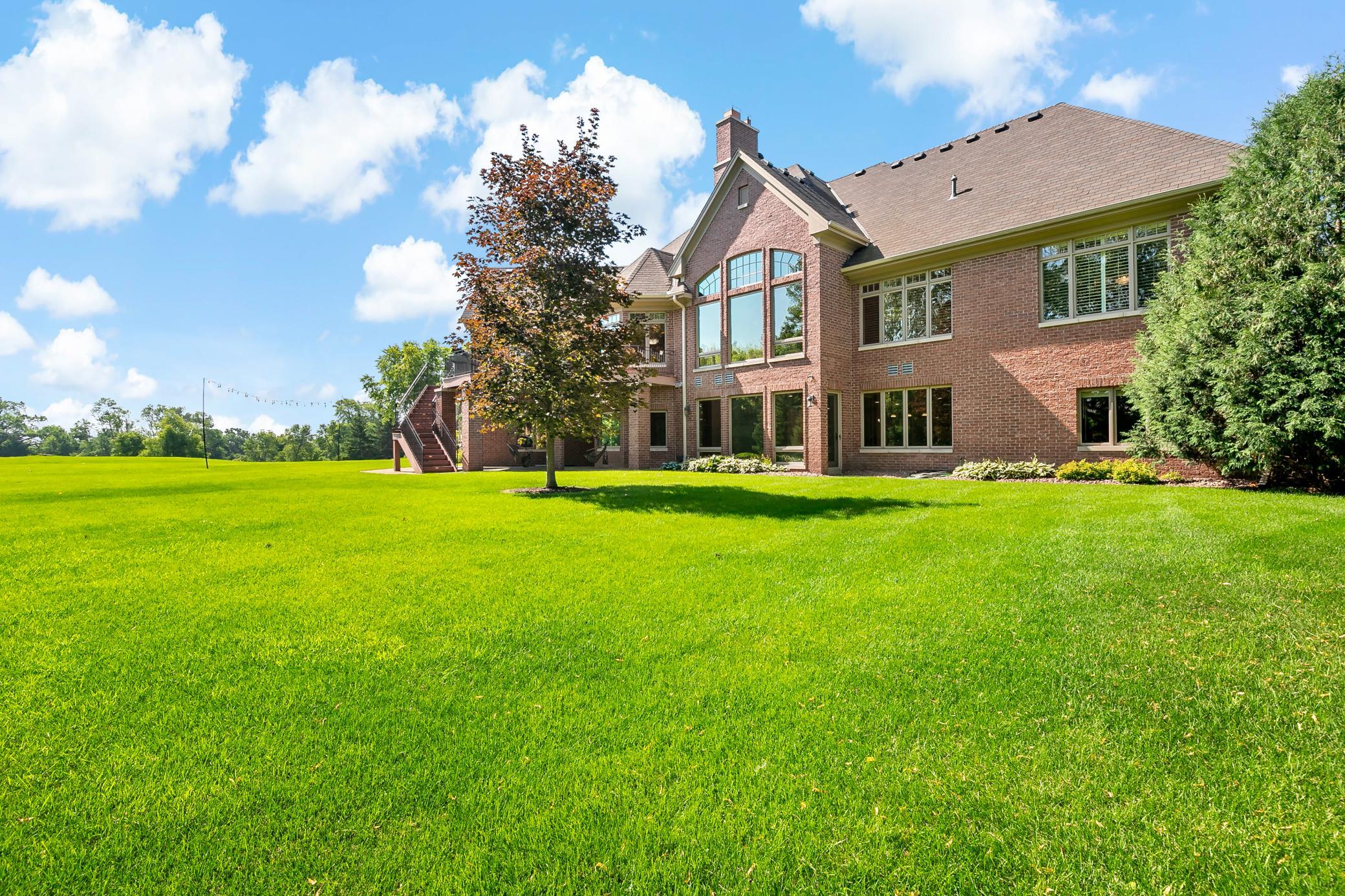 Designed for executive living with maintenance-free all-brick construction, premium 50-year shingles, and timeless curb appeal.