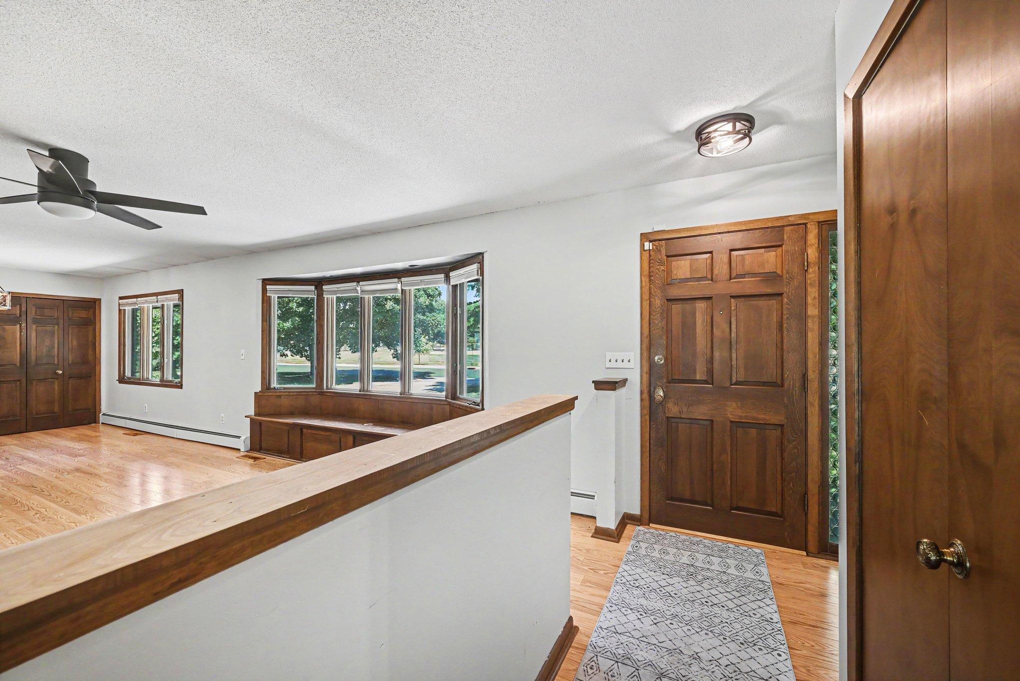 Front Hallway with Solid Wood Door