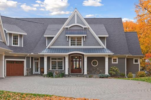 A covered front porch and convenient service door entrance offers a warm & welcoming entryway into the home