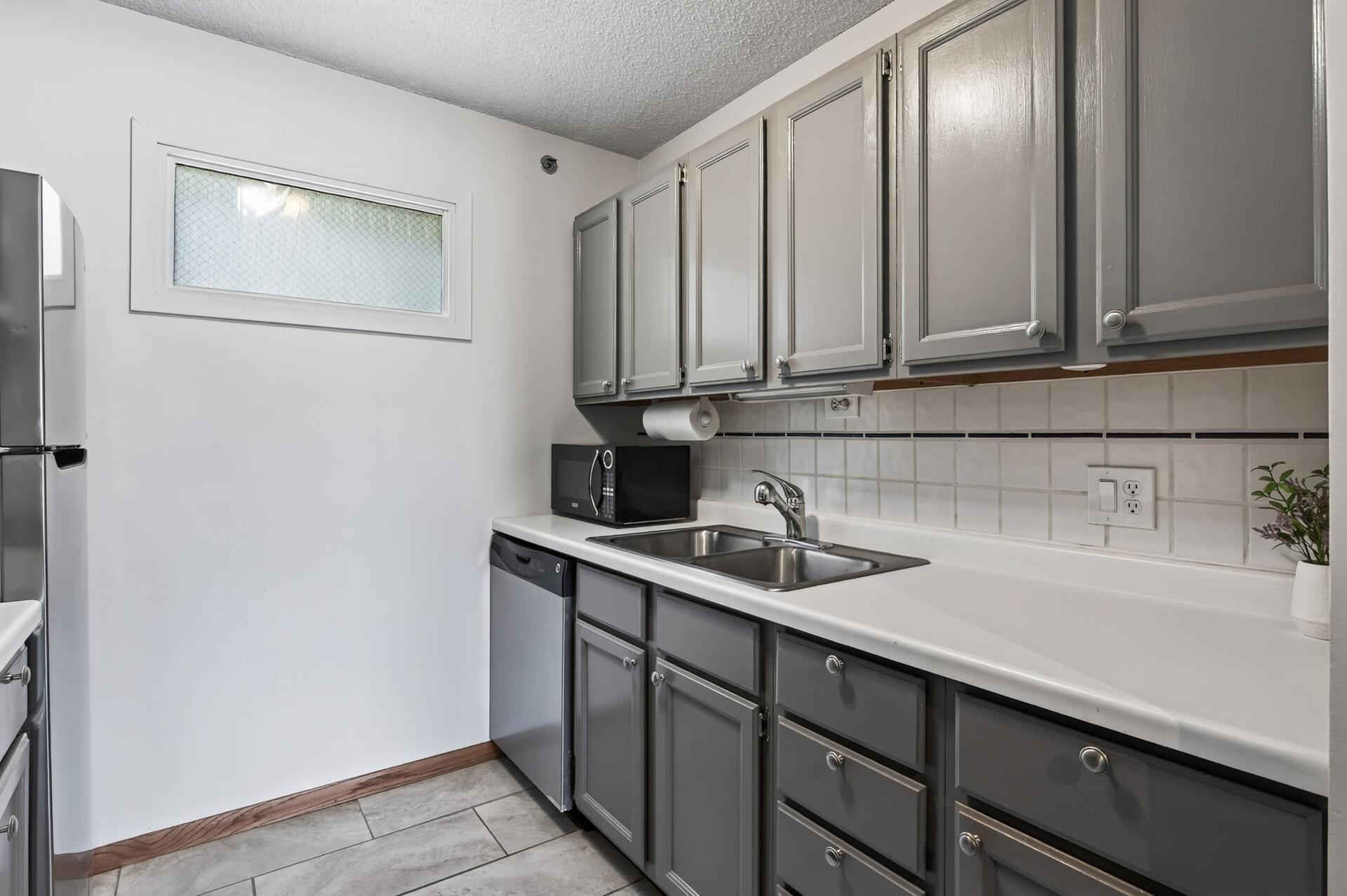 Cabinets include a trash pullout