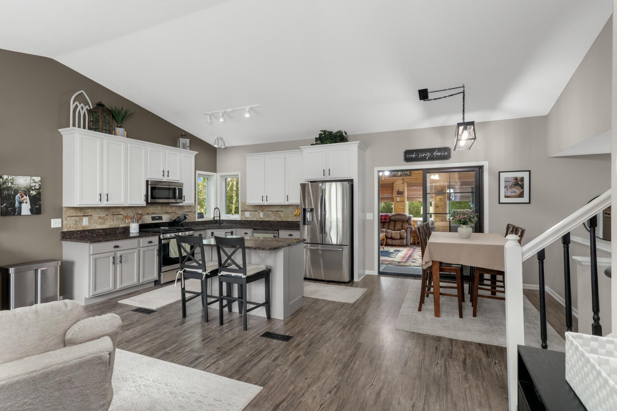 Welcoming entryway showcasing soaring vaulted ceilings and an inviting first impression.