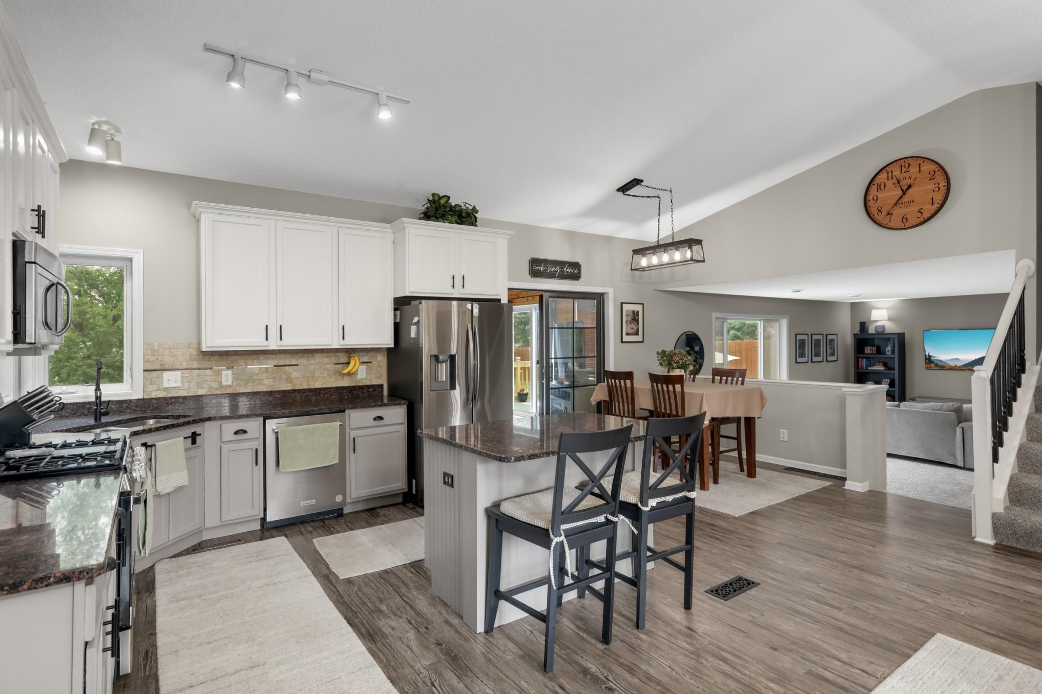 Newer LVP flooring throughout the open-concept kitchen