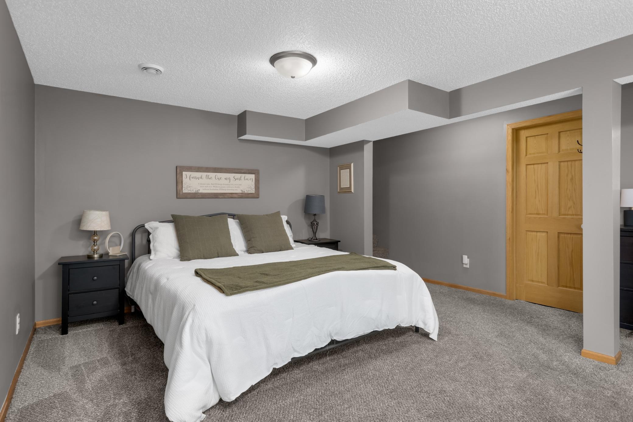 Spacious lower-level bedroom offering comfort and versatility.