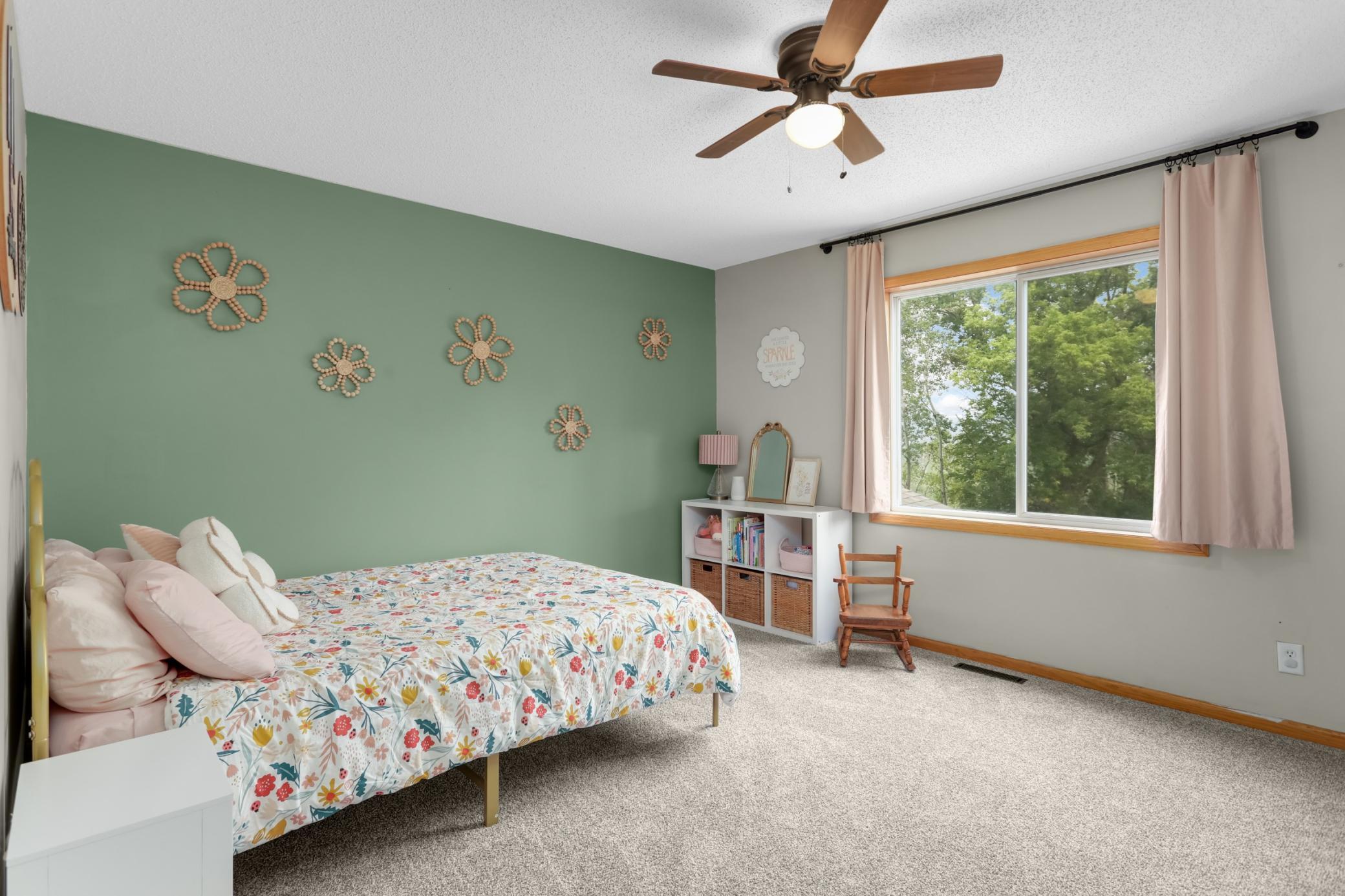 Expansive upper-level bedroom with a large walk-in closet.