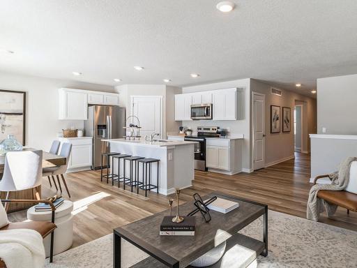 View of dining area and modern kitchen from the living room.