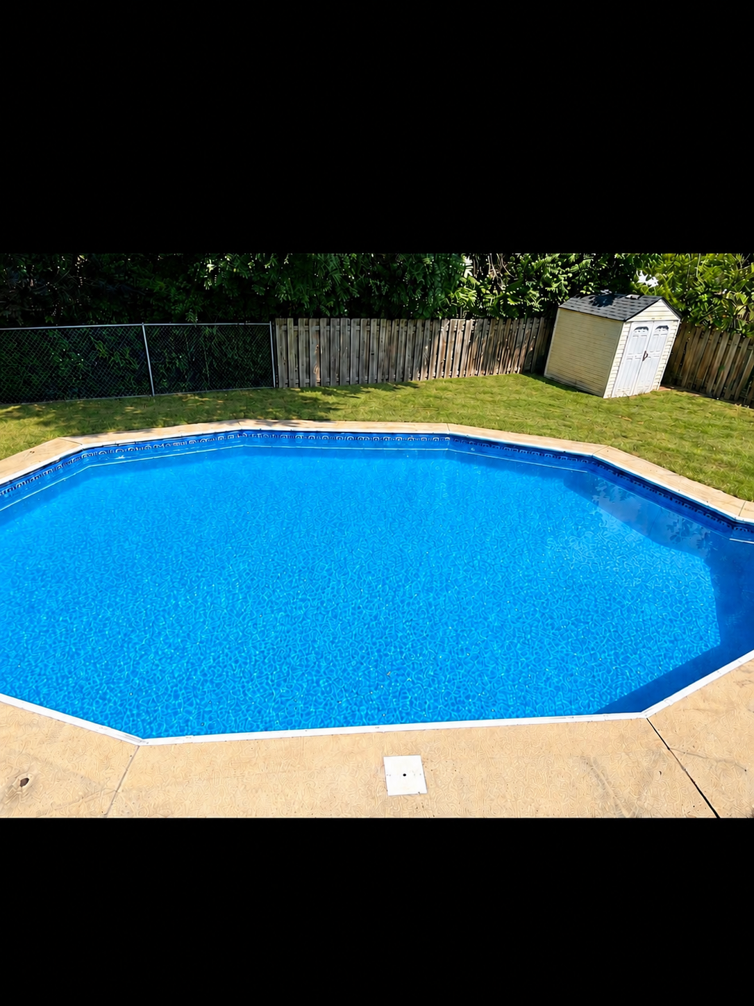 Fully fenced yard and additional small shed for pool and yard items