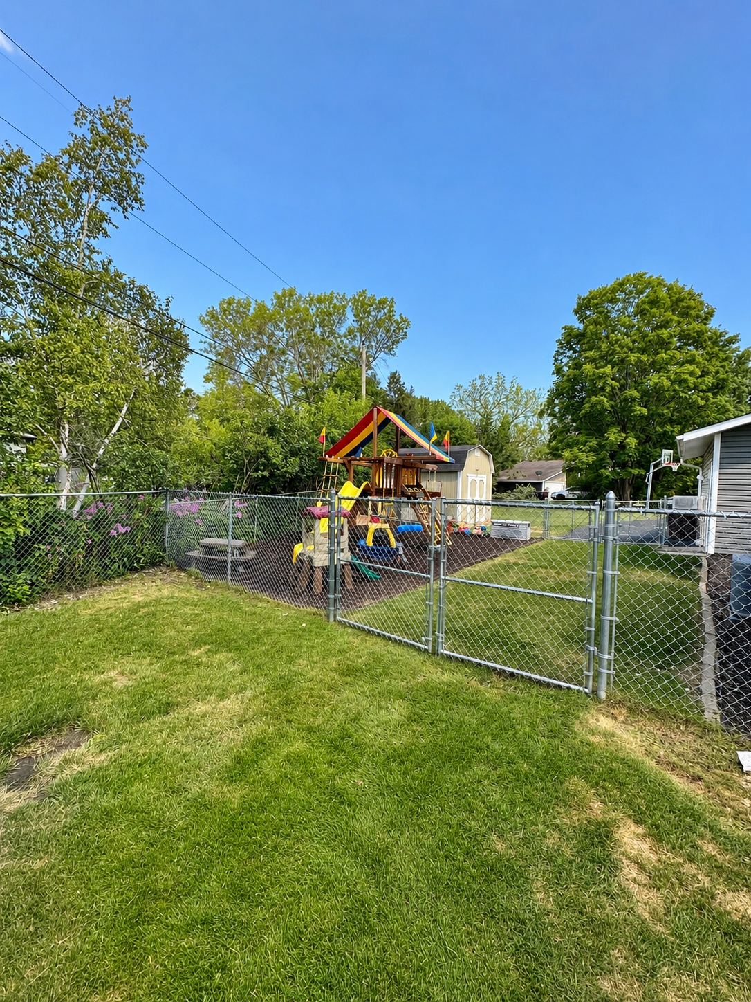 Separate fenced play yard with play structure