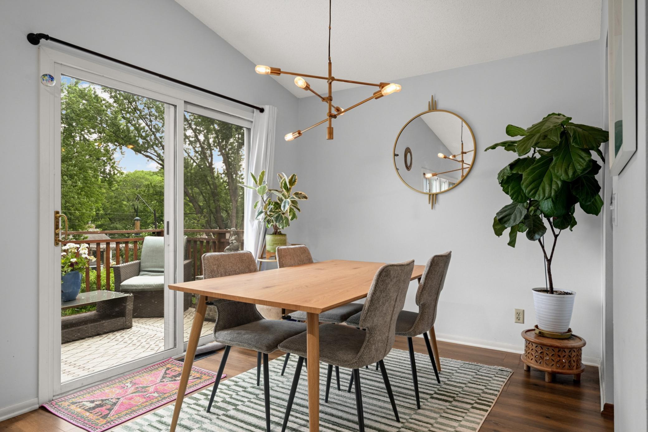 This space is comfortable and charming, and offers access to the deck.