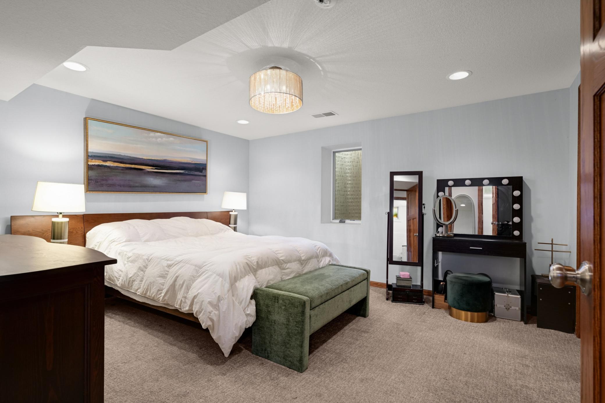 The Primary Bedroom is bedroom 1 of 4, is in the lower level and boasts a fantastic walk in closet.