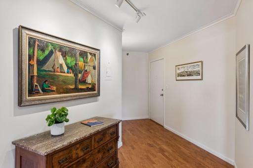 Spacious front entry/foyer area with coat closet.