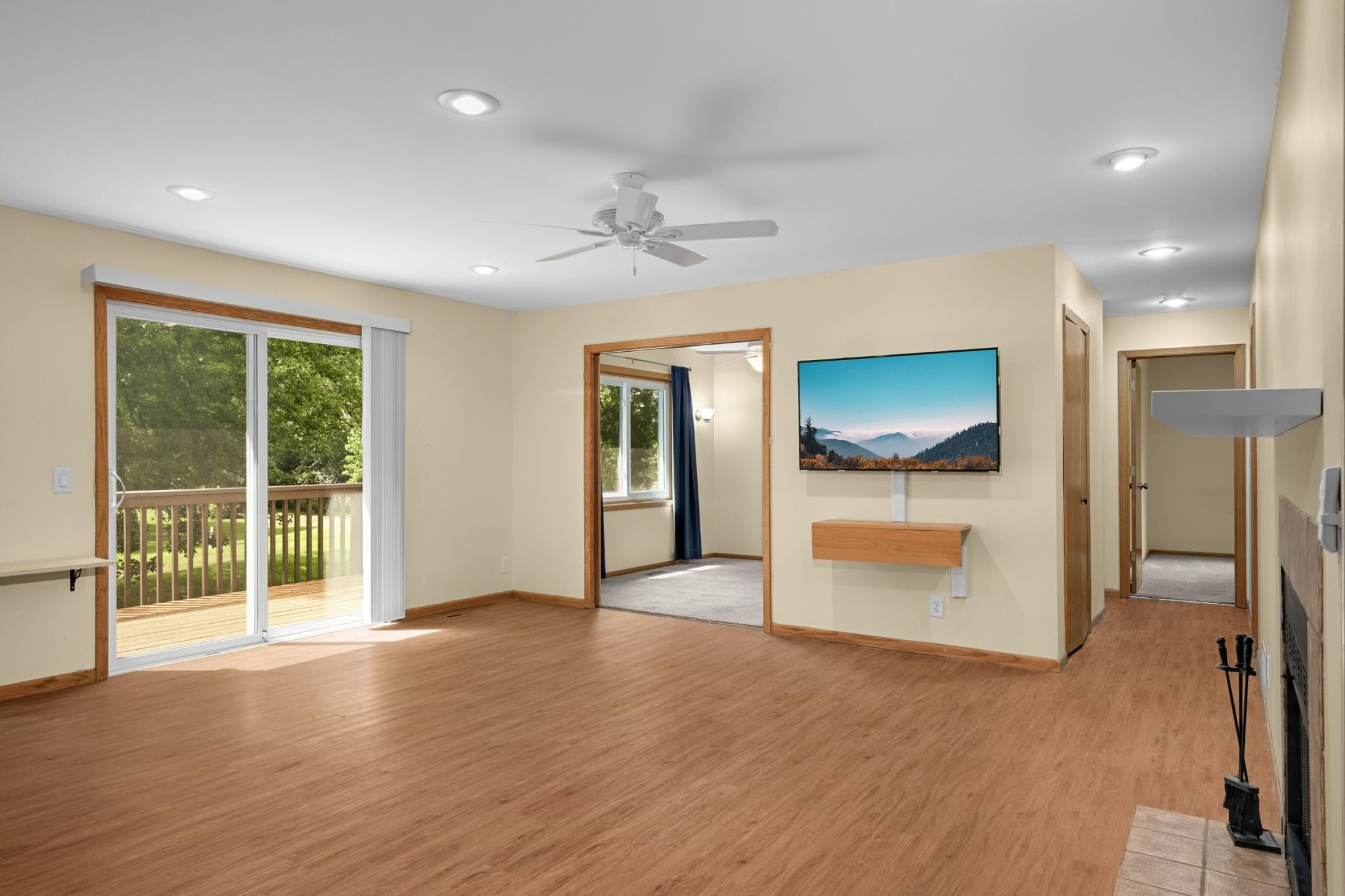 Two patio doors go out to large deck. Spacious living room..bonus TV is included. Check out the sliding door that enters den-office ( 11 x 10 ) which can be used as a 3rd bedroom.