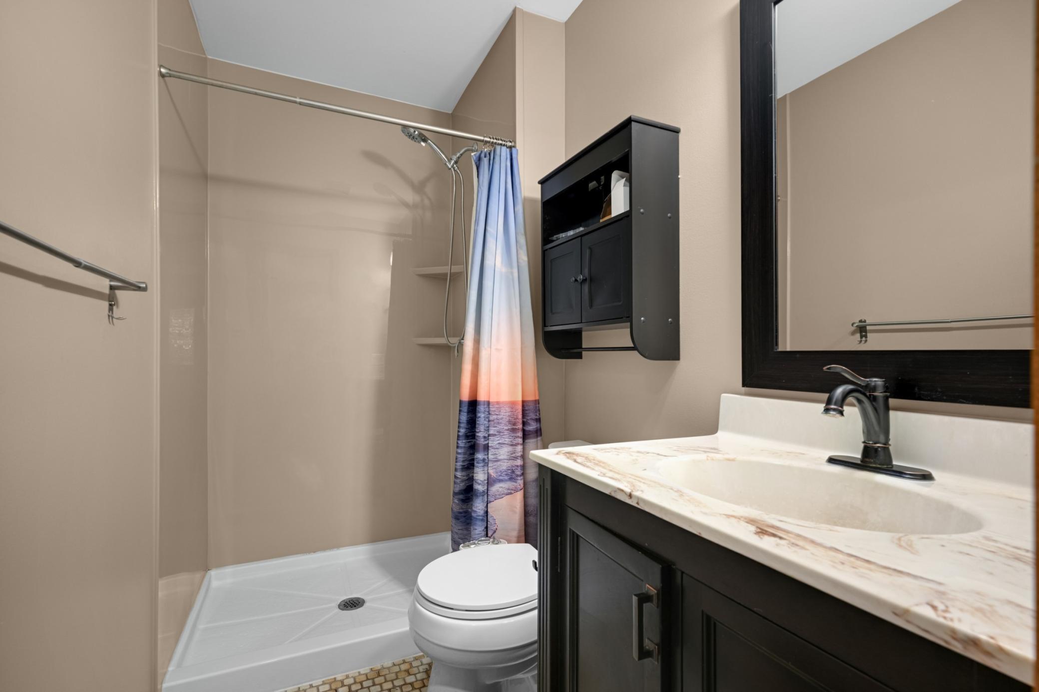 Owners suite Ceramic floor. Shower stall new approx 2022, newr toilet