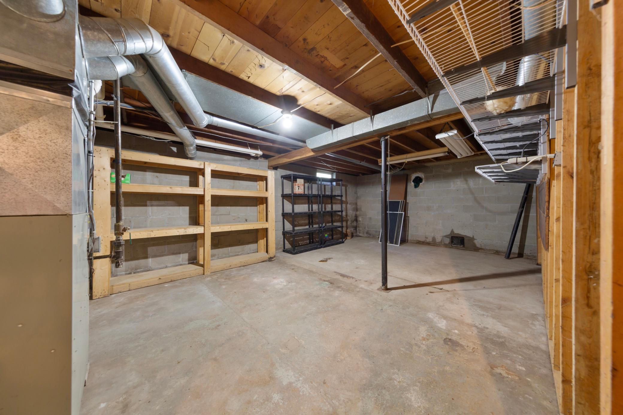 Unfinished basement has plenty of storage space