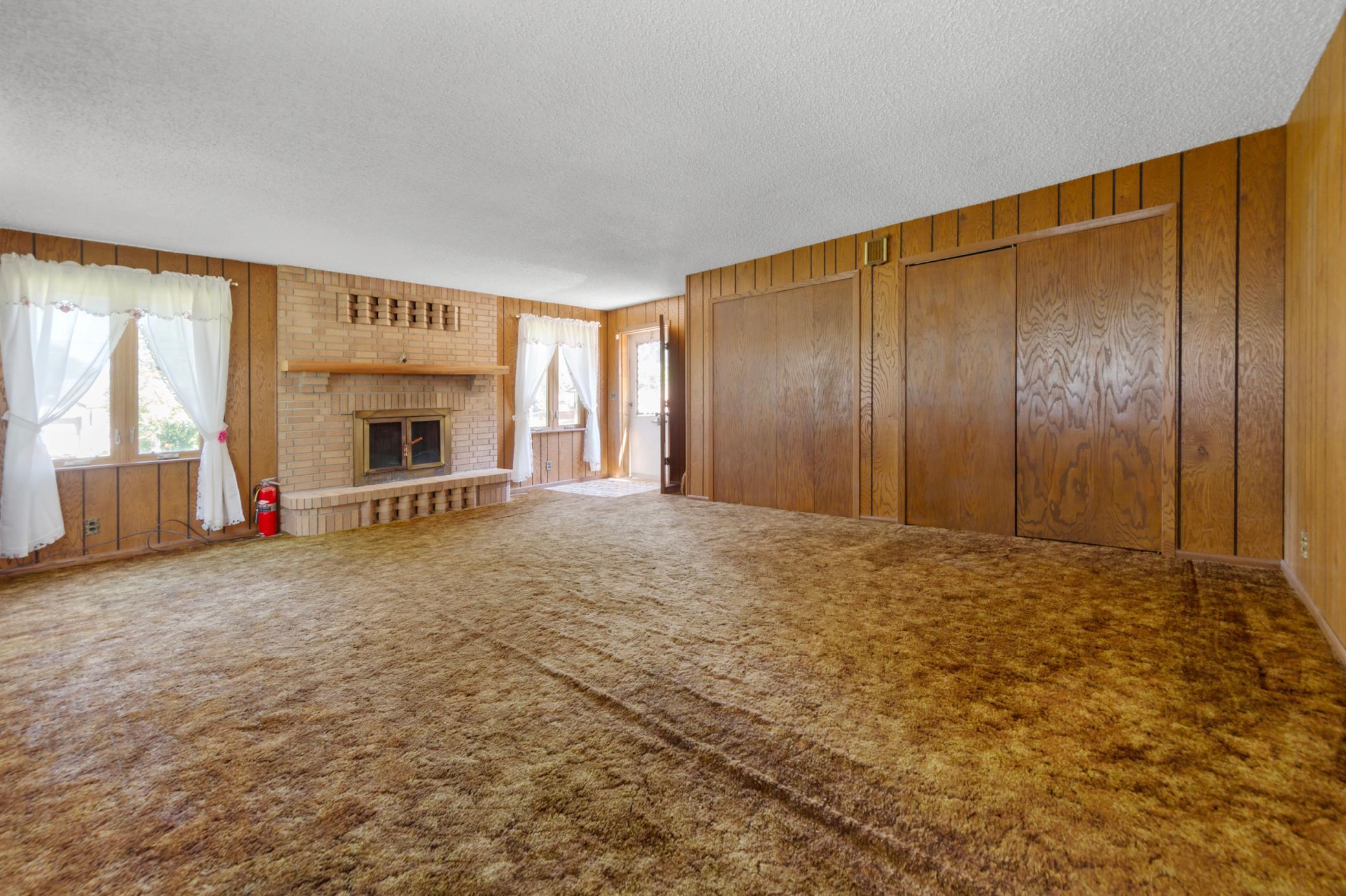 Living room has 2 closets