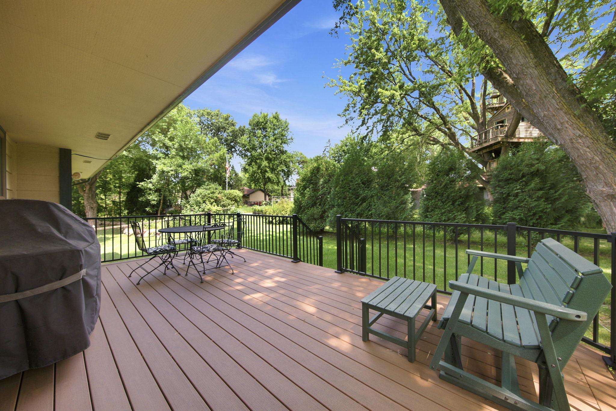 Expansive Trex deck overlooking a fantastic backyard!