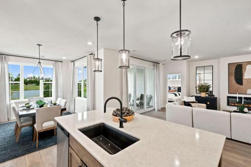The kitchen is central to the dining and living areas