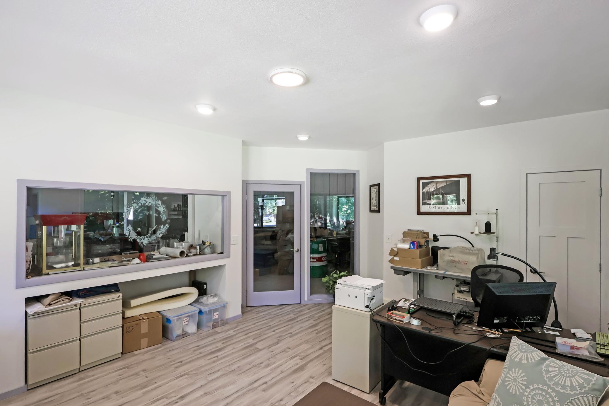 Dedicated office space with windows into the shop.jpg