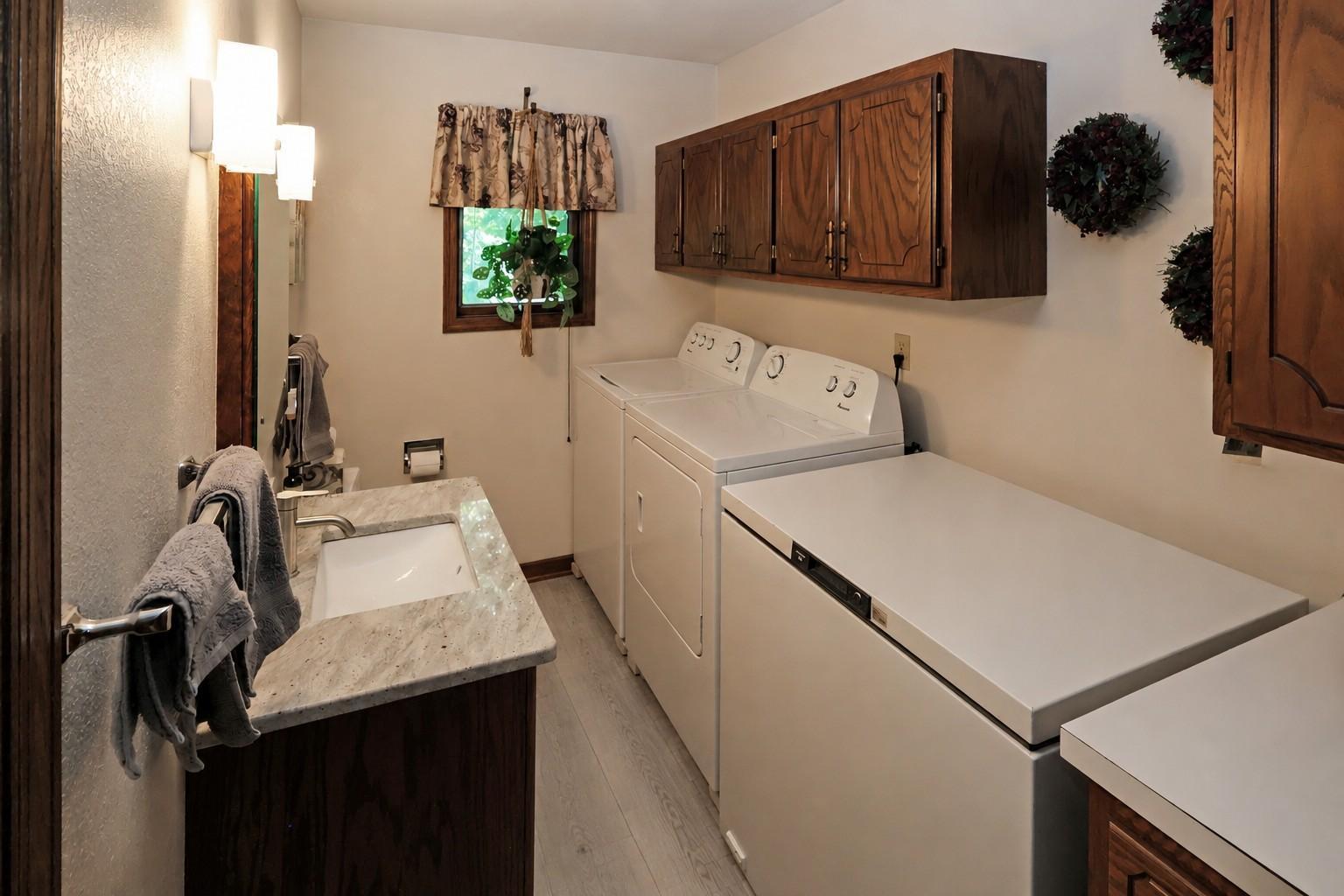 Main level laundry and half bath (Seller is ready to install New LVP).jpg