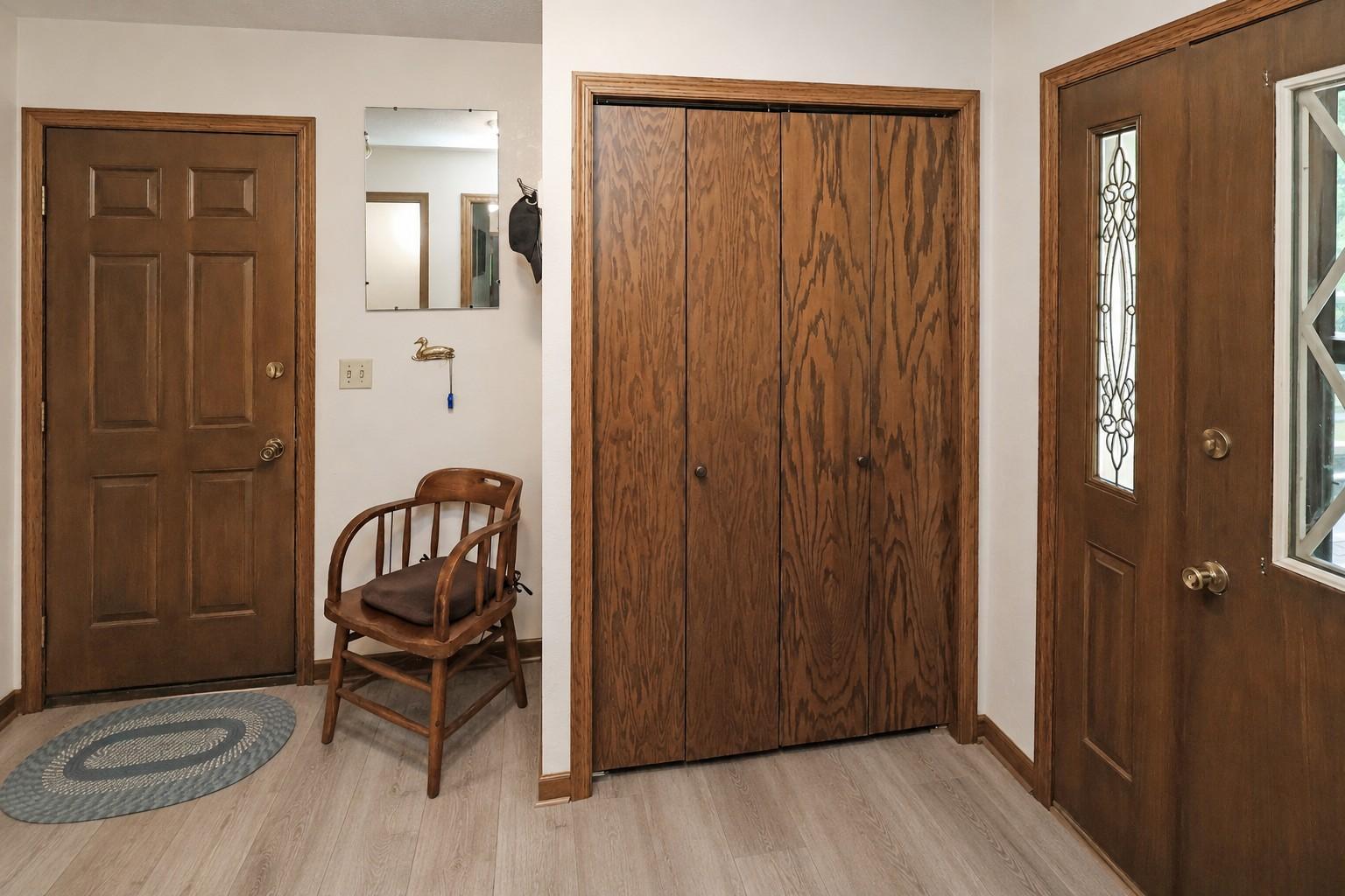 Main entry with coat closet and garage entrance (Seller is ready to install New LVP).jpg