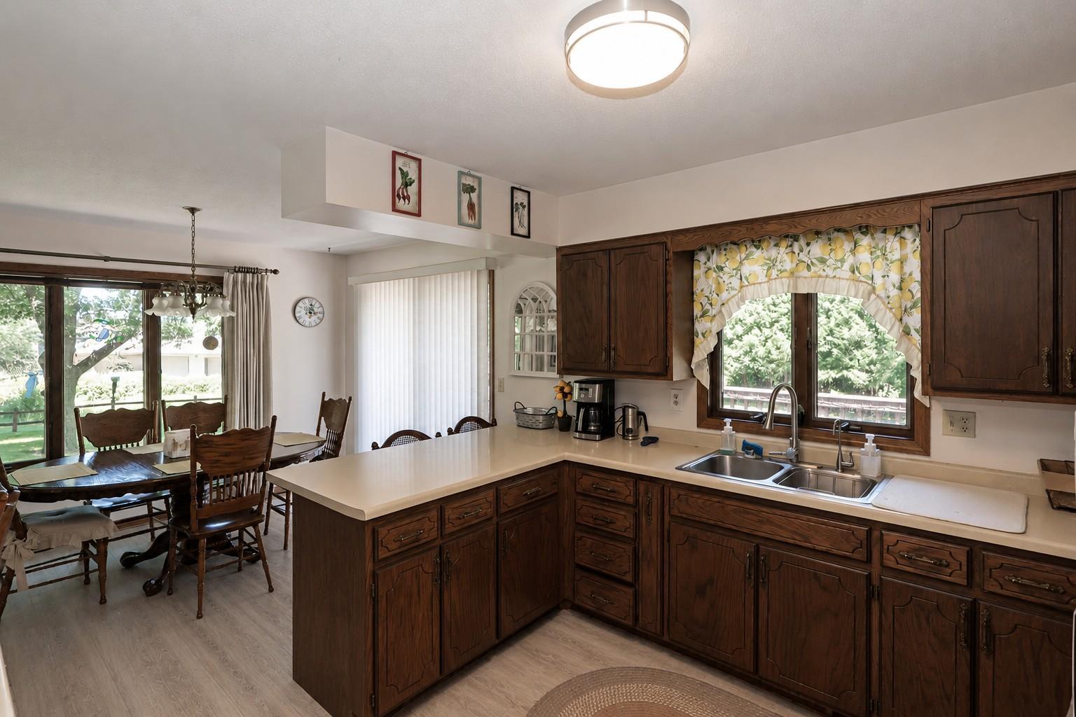 Open kitchen to dining (Seller is ready to install New LVP).jpg