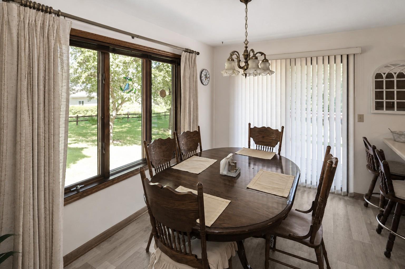 Dining area off the kitchen with patio door to the deck (Seller is ready to install New LVP).jpg