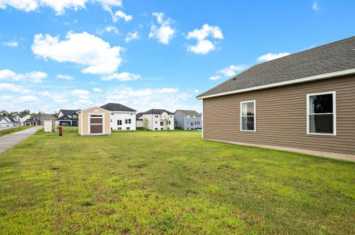 Larger back yard with nice buffer between homes.