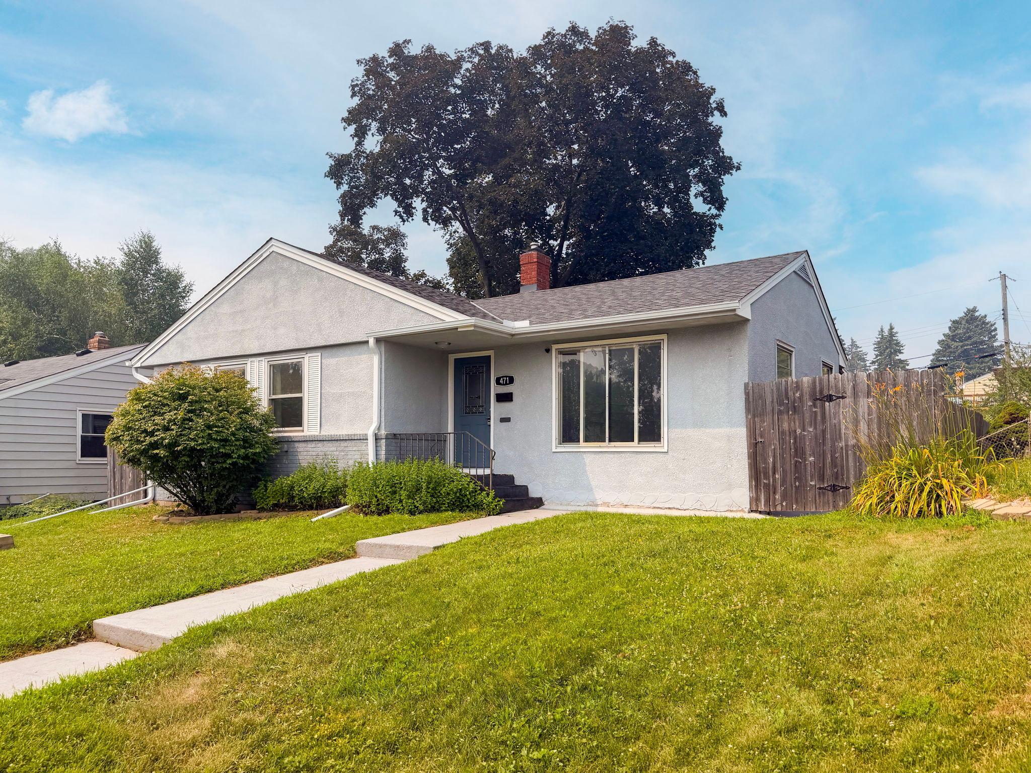 Blue sky, green grass, and a brand new roof overhead giving you one less thing to think about. This is the kind of curb appeal that makes you slow down before you even park.
