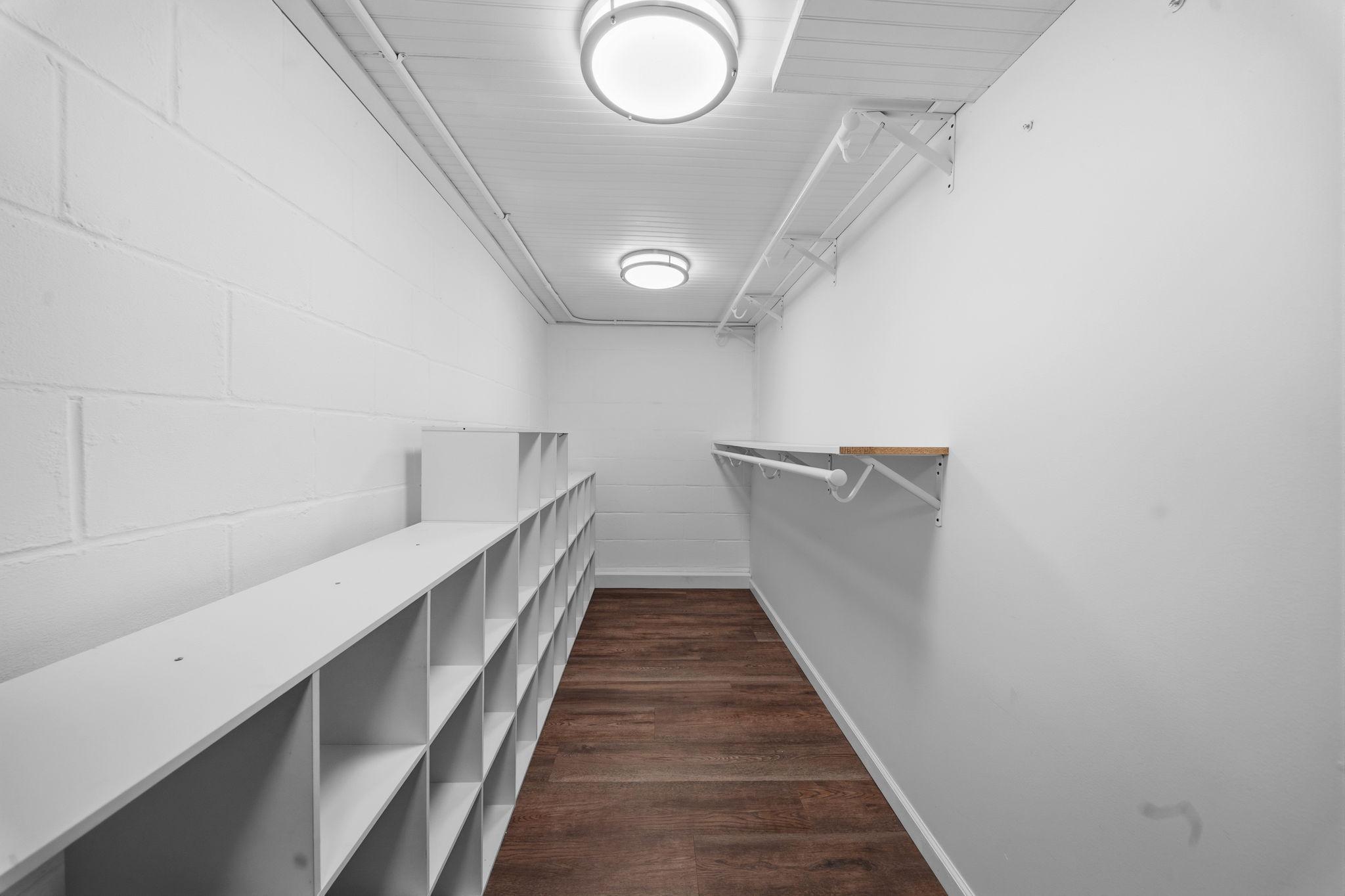 The third bedroom comes with real storage, not an afterthought. Built in shelving on one side, a hanging rod on the other, room enough for every season of clothes.
