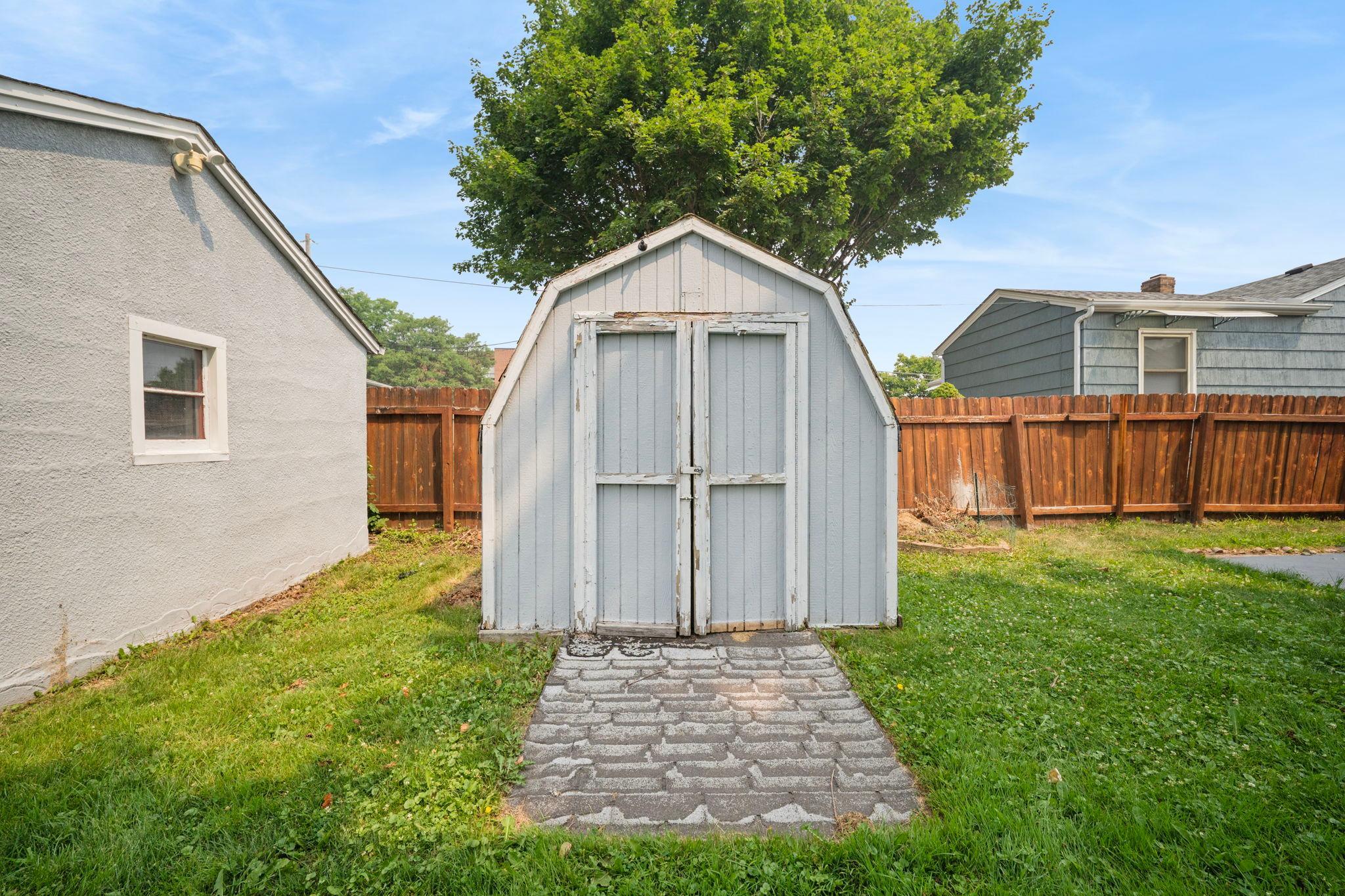 A classic storage shed ready for tools, bikes, or a weekend project space of your own.