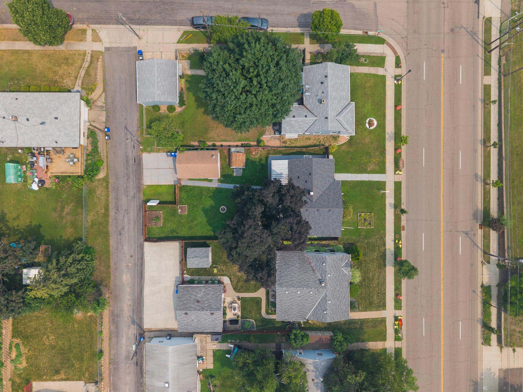 The full footprint from above, house, patio, garage, and garden bed all working together as one complete picture of home.