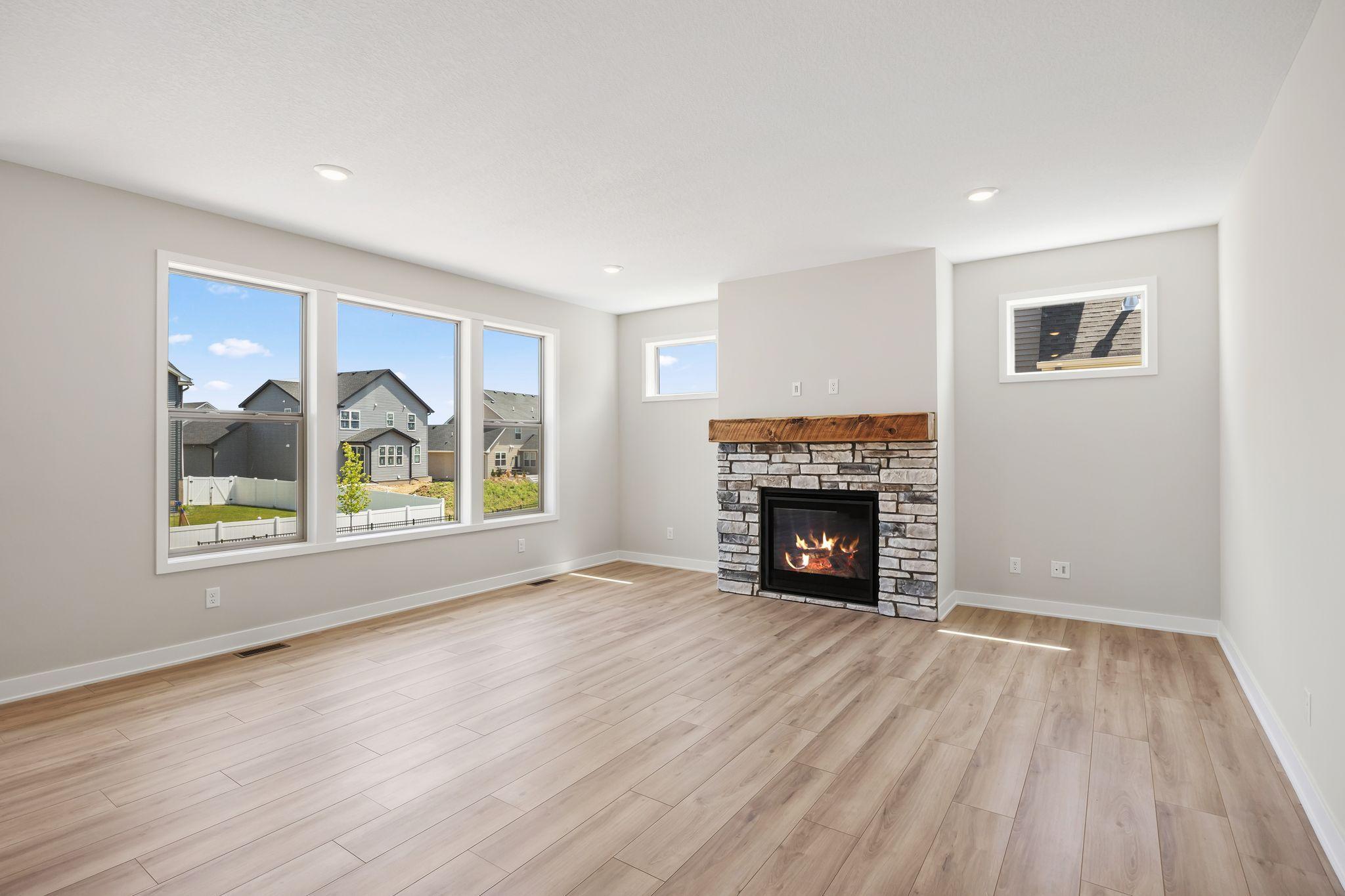 Gas fireplace with window on each side.