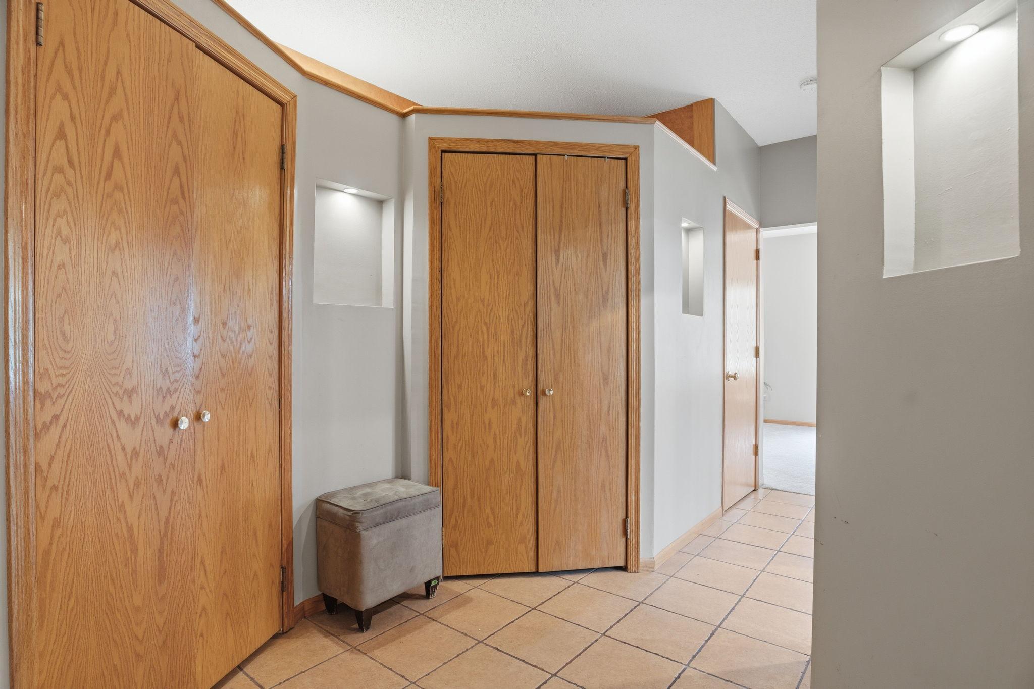 Tucked niches and generous closets line this upper hallway, thoughtful storage worked into every turn on the way to the bedrooms.