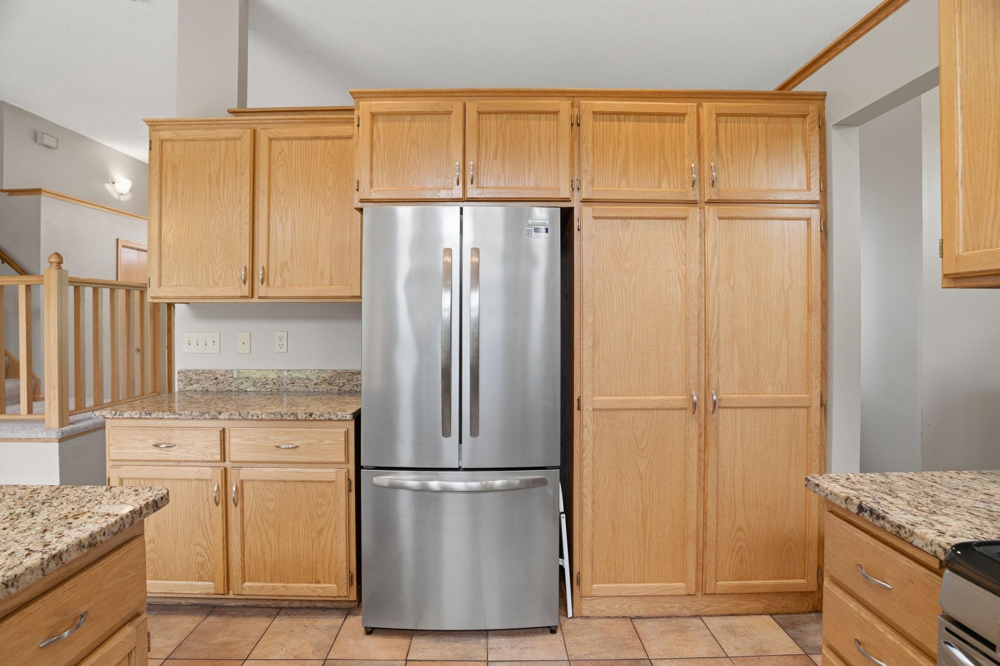 Floor-to-ceiling cabinetry wraps the kitchen wall. Room for everything. The kind of storage that makes cooking feel calm instead of chaotic. All the space you've been waiting for.