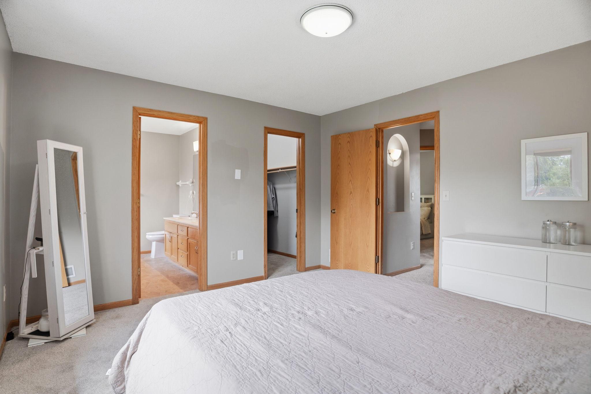 The primary suite delivers privacy and convenience, with direct access to its own bathroom and a dedicated walk in closet just steps from the bed.