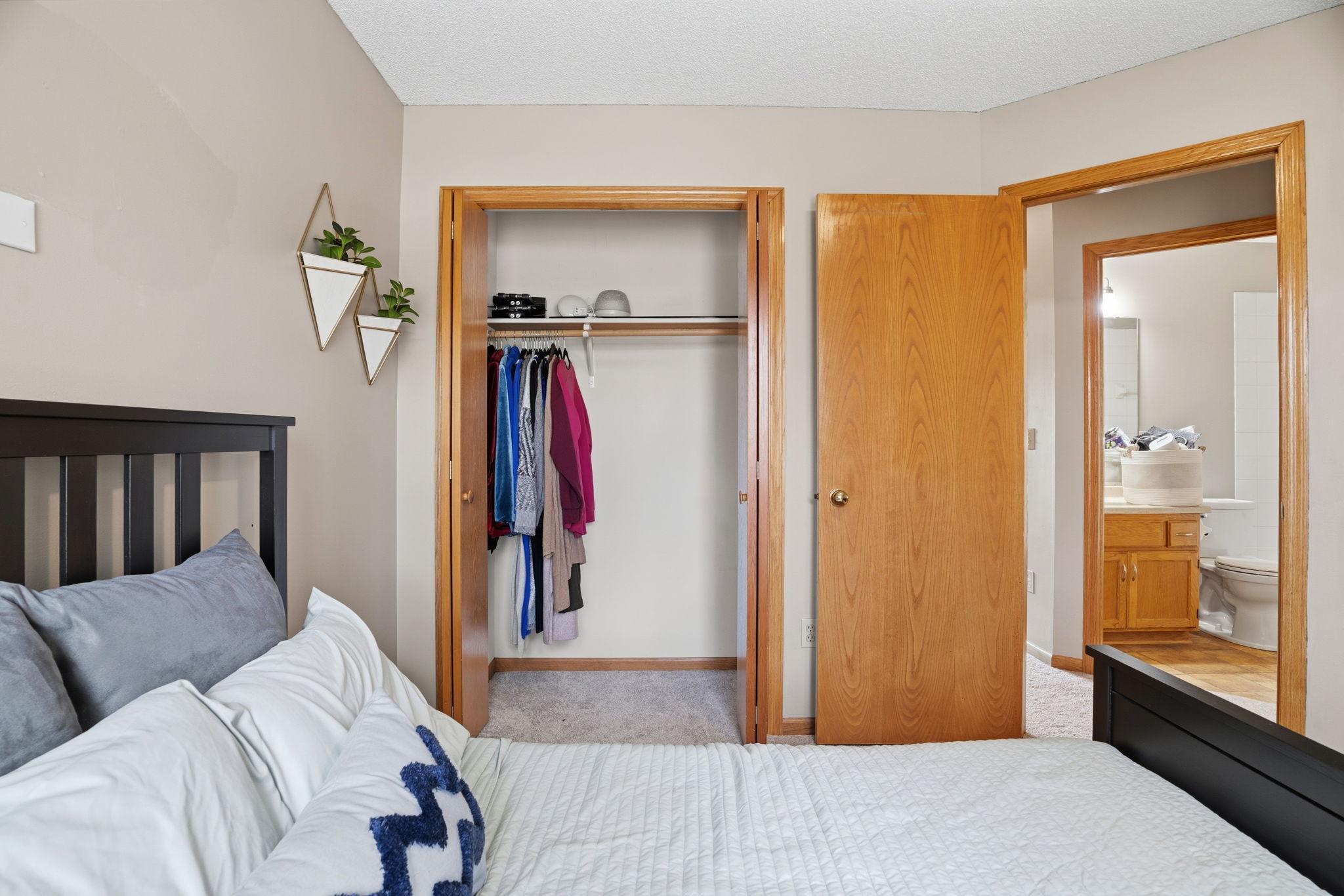 Bedroom closet and bath access visible from one angle. Self-contained, ready-made for guests, teenagers, or anyone who needs their own quiet corner.