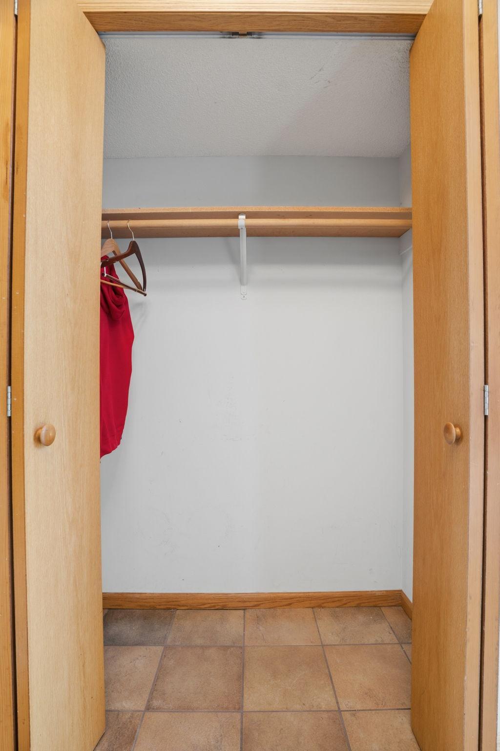 Tucked behind its own door, this closet offers hanging space and a shelf overhead, one of several surprise storage spots the seller says keep turning up.