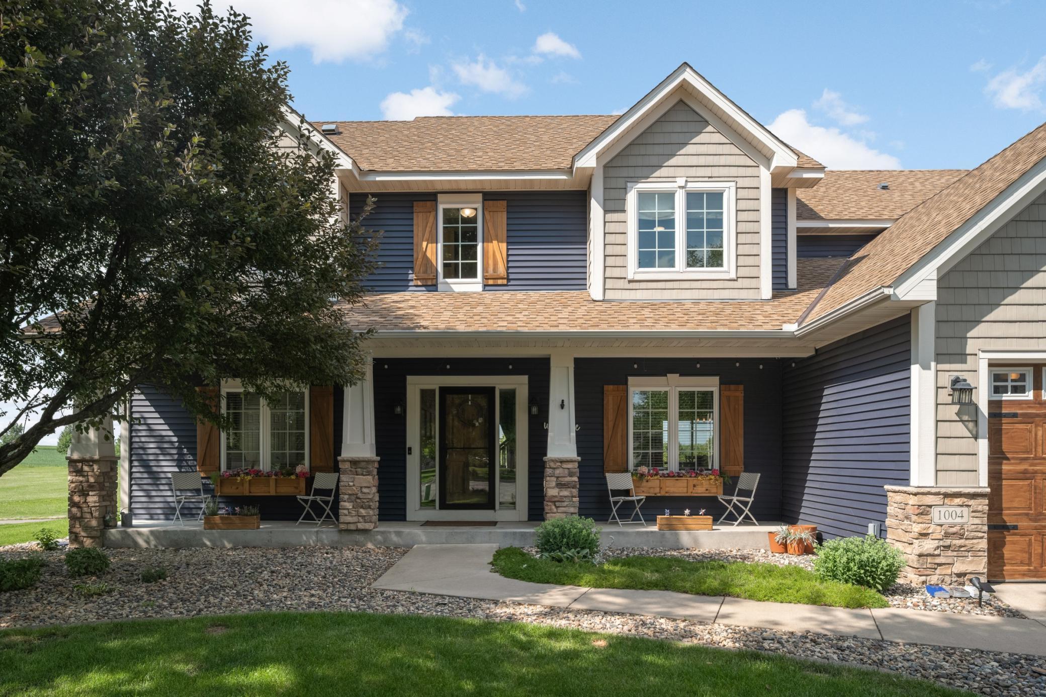 Frontof home with wonderful landscaping.