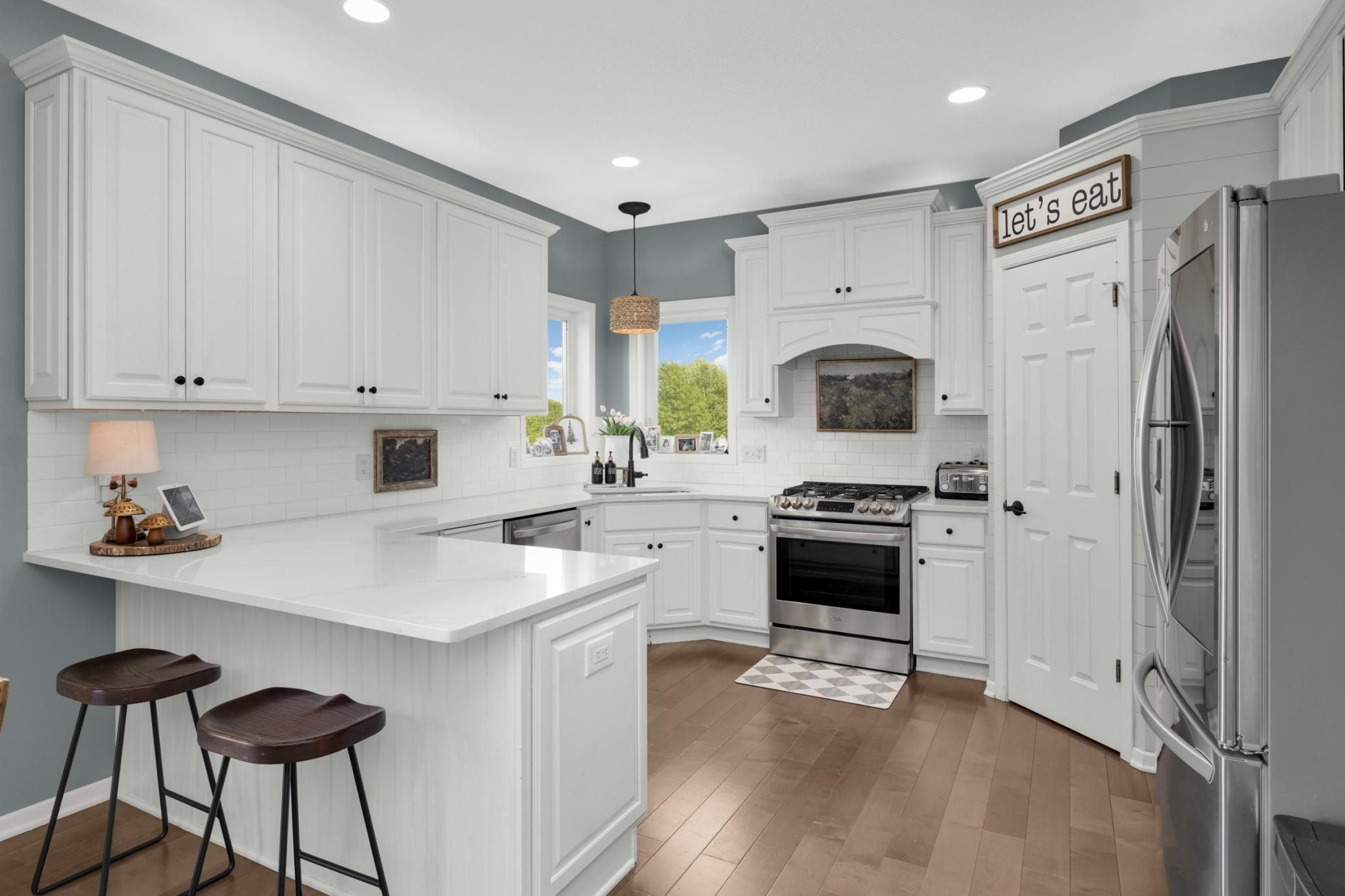 Beautiful kitchen with new quartz countertops in 2026. Nice pantry!