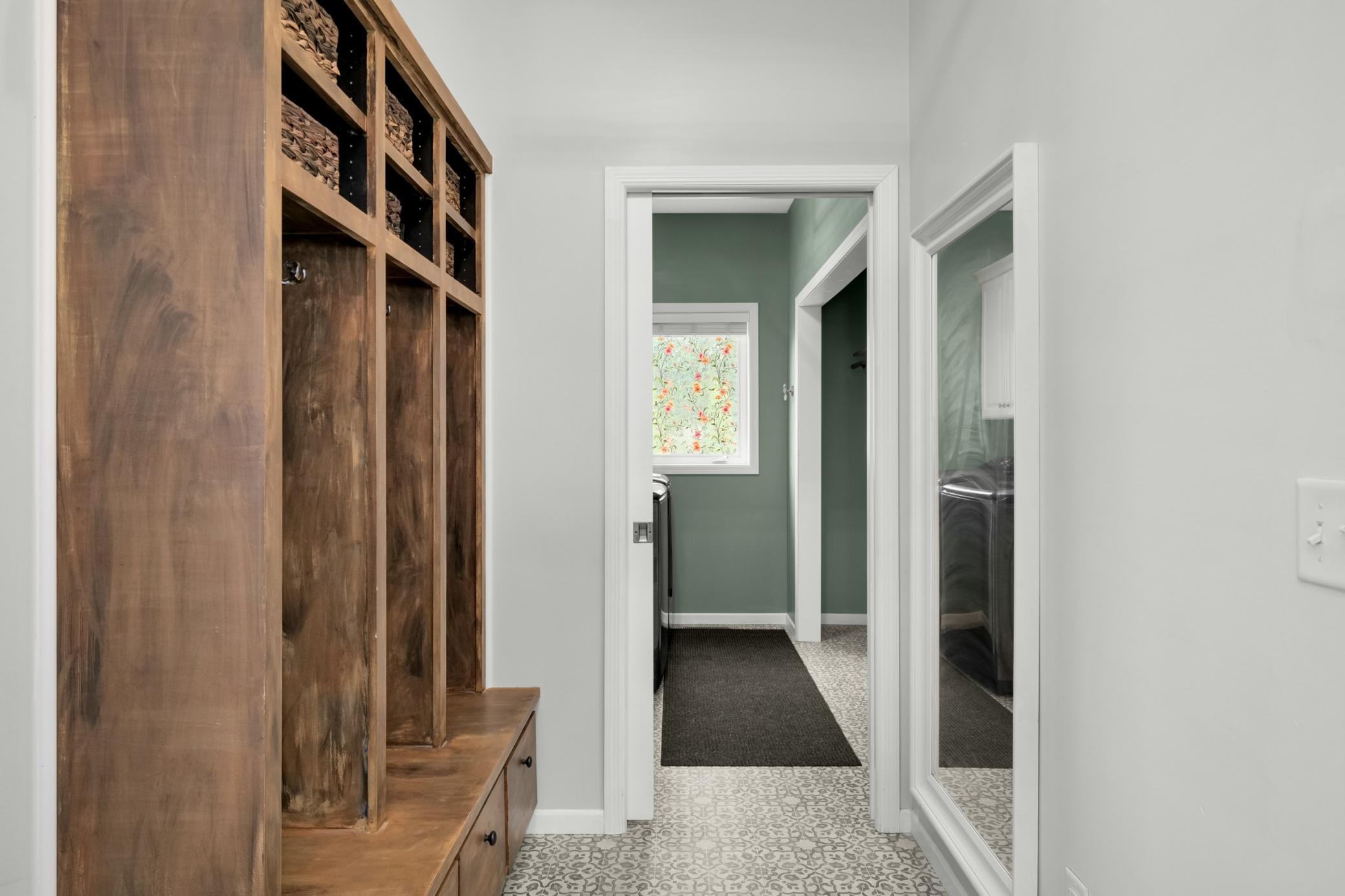 Mud room that is off the kitchen connected to laundry room.