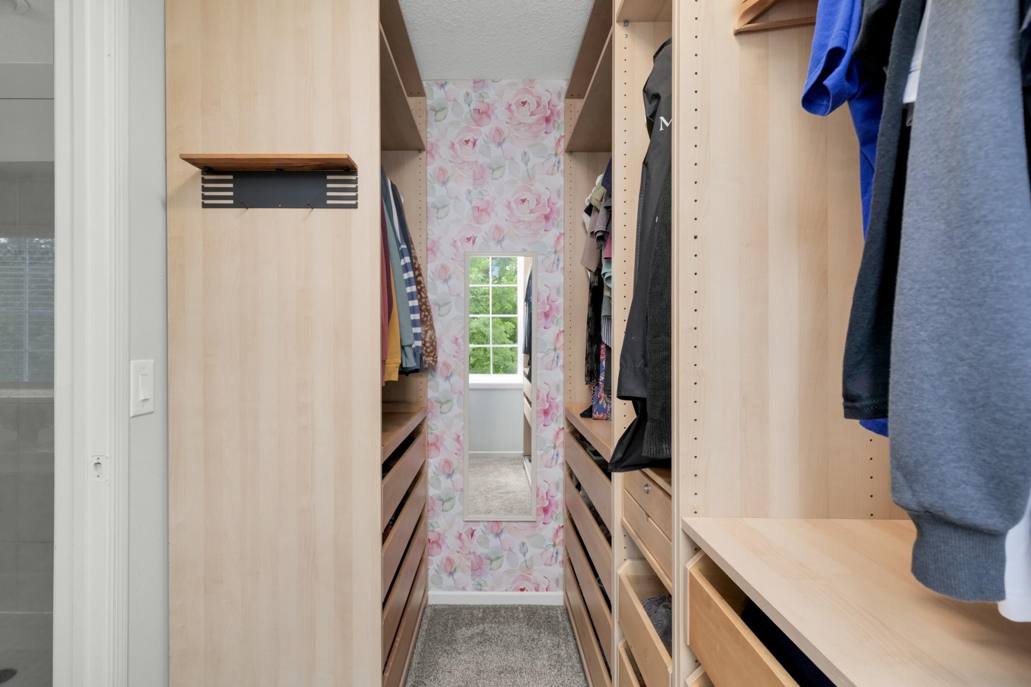 Walk in closet with plenty of space for your belongings.
