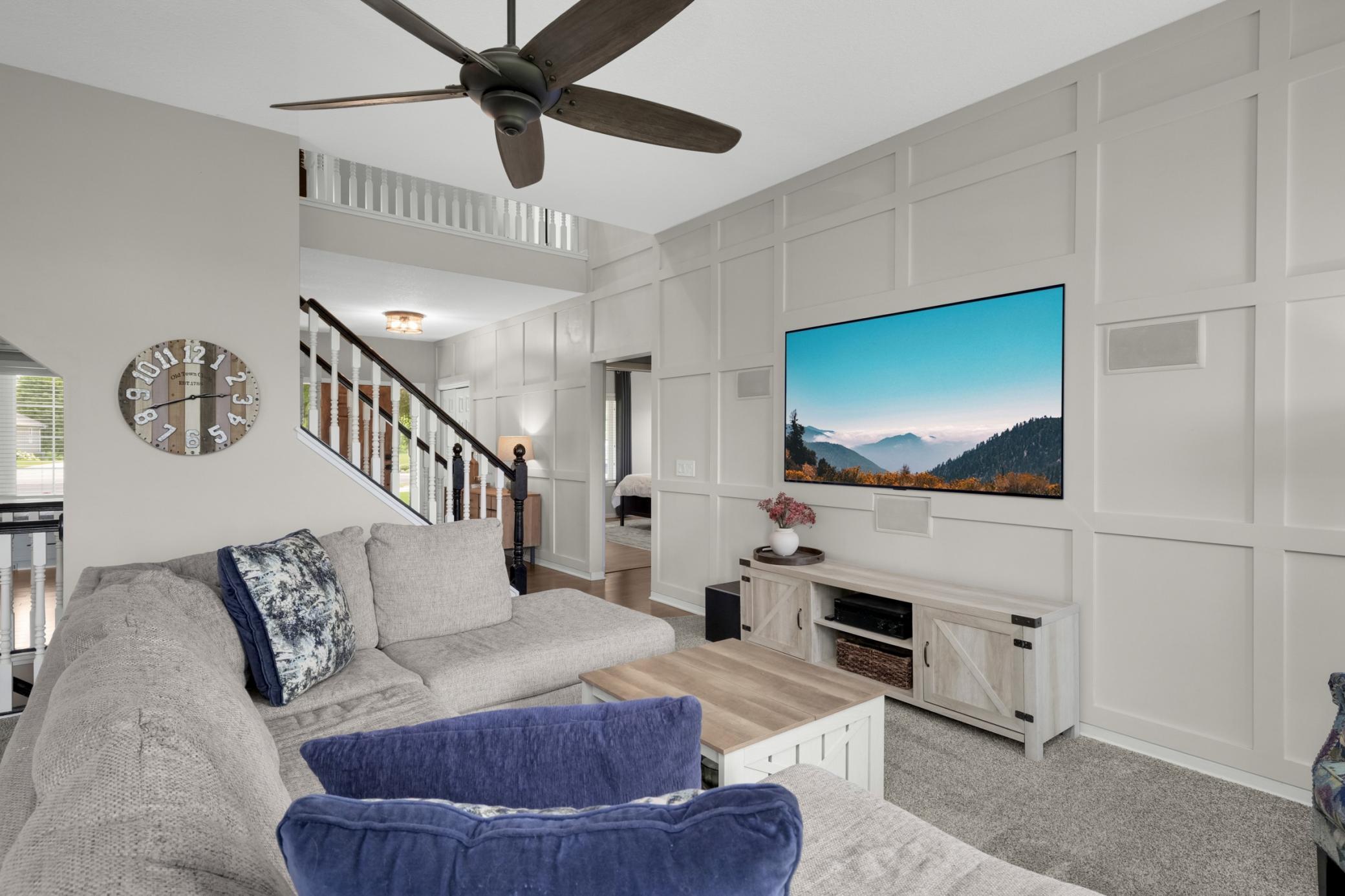 Family room with custom TV wall and is very cozy.