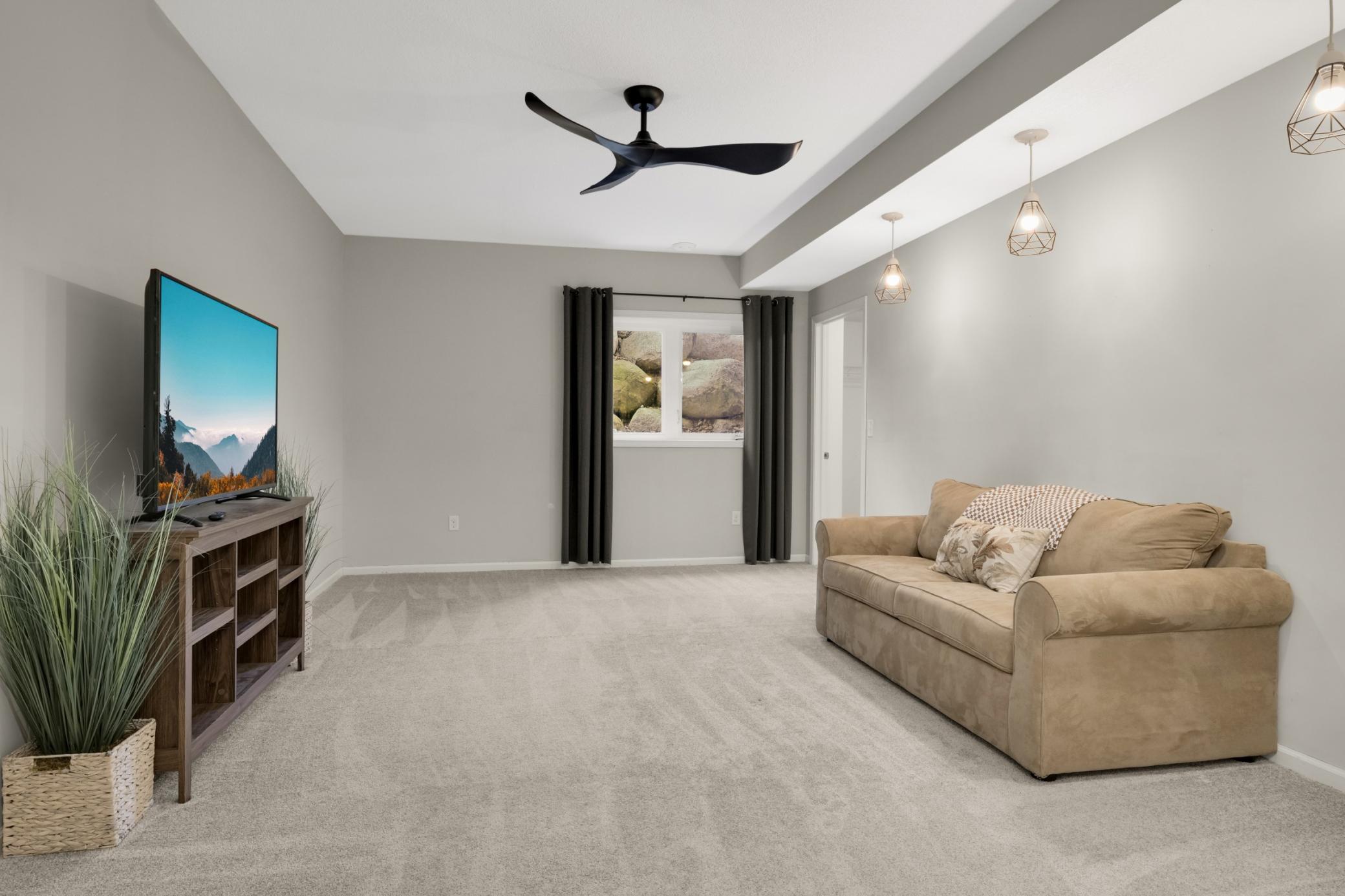 Lower-level bedroom with walk in closet and plenty of room for you. Being used as TV room for now.