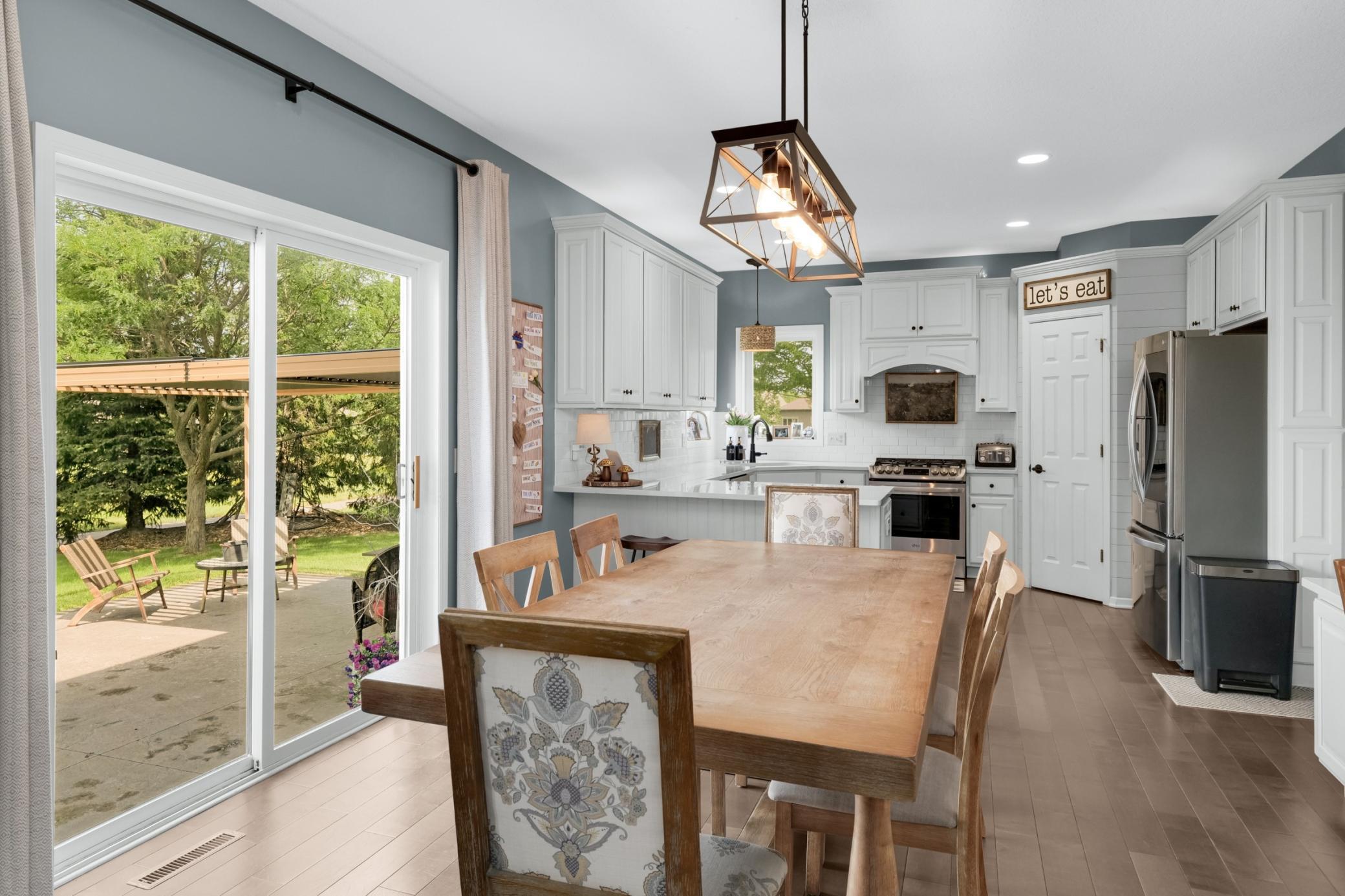 Dining area with views of patio and park.