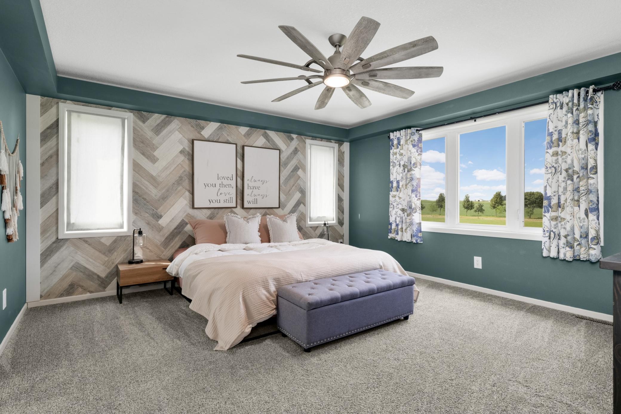 Upstairs primary suite that is beautifully decorated and great outdoor views.