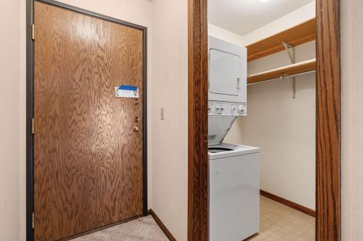 Laundry chores are a cinch with stacked washer & dryer off entryway