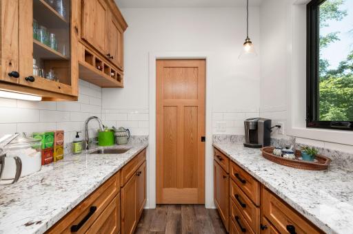 Multi-functional 8 x 6 walk-thru pantry with sink!