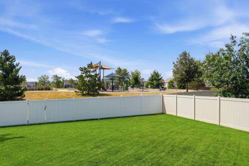 This home offers the perfect blend of privacy and connection with a community park just steps from the backyard.