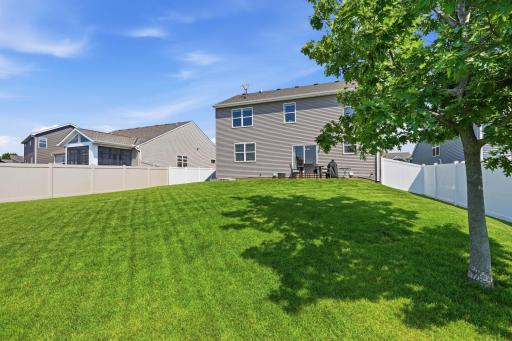 Nicely maintained yard with an underground sprinkler system to help keep the landscape looking its best.