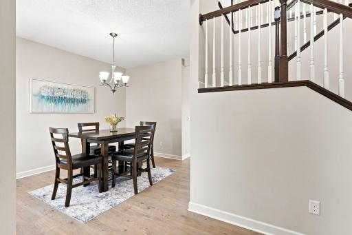 Versatile front room designed as additional dining space.