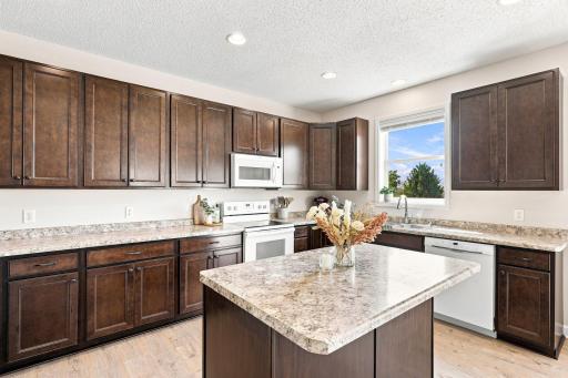 Expansive kitchen offers abundant cabinetry.